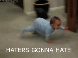 A Baby Is Crawling On The Floor With The Words Haters Gonna Hate Above Him GIF