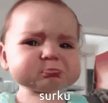 A Baby Is Crying With The Word Surku Written On The Bottom Of His Face . GIF