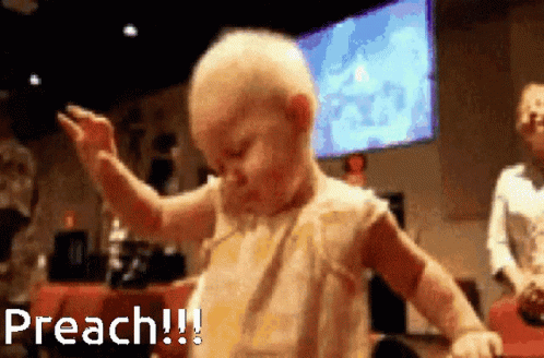 A Baby Is Dancing In Front Of A Large Screen That Says Preach GIF