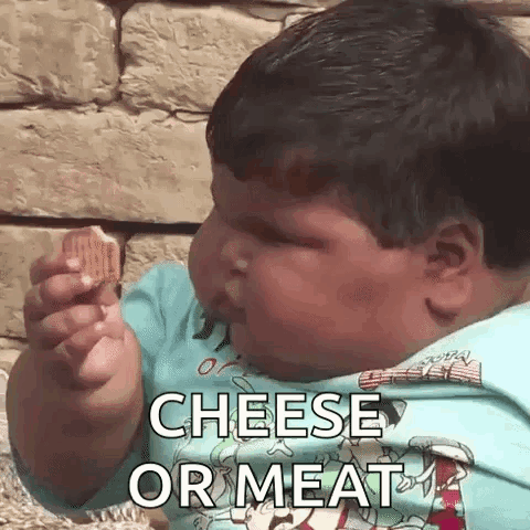 A Baby Is Eating A Piece Of Cheese With The Words Cheese Or Meat Written On It . GIF