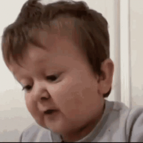A Baby Is Making A Funny Face And Making A Funny Face . GIF