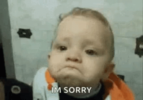 A Baby Is Making A Funny Face And Saying `` Im Sorry '' . GIF