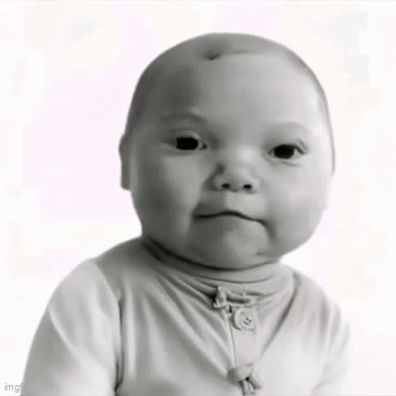 A Baby Is Making A Funny Face In A Black And White Photo . GIF