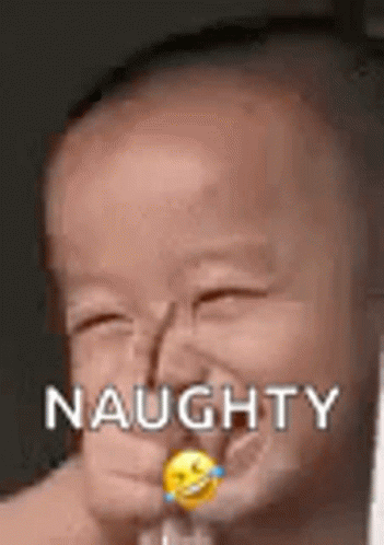 A Baby Is Making A Funny Face With A Smiley Face In His Mouth . GIF