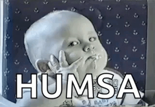 A Baby Is Making A Funny Face With His Hands In His Mouth And The Words Humsa Written Above Him . GIF