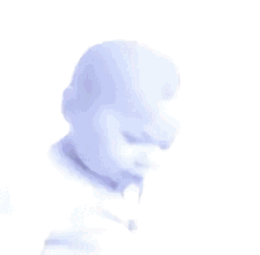 A Baby Is Making A Funny Face With His Mouth Open . GIF