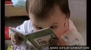 A Baby Is Reading A Book With Make Gifs At Gifsoup.com At The Bottom Of The Screen GIF