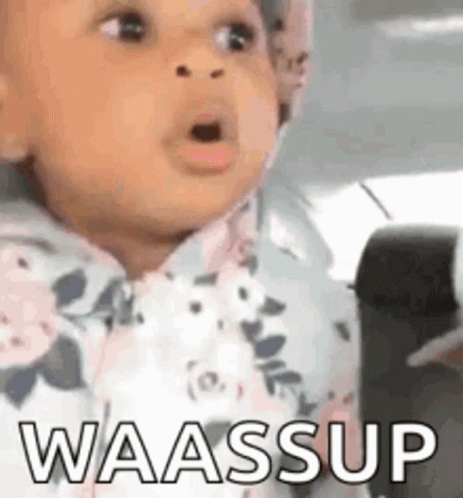 A Baby Is Sitting In A Car Seat And Making A Funny Face With The Words Waassup Written On It . GIF
