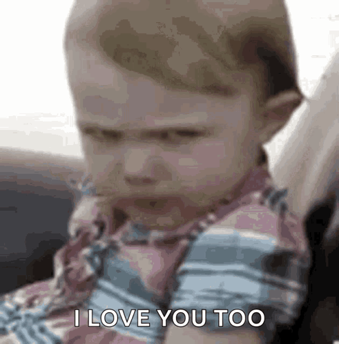 A Baby Is Sitting In A Car Seat And Saying I Love You Too . GIF