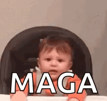 A Baby Is Sitting In A High Chair And Making A Funny Face . GIF
