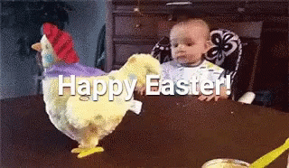A Baby Is Sitting In A High Chair Next To A Stuffed Chicken That Says Happy Easter GIF
