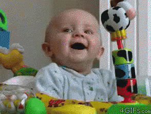 A Baby Is Sitting In Front Of A Table With Toys And The Website 4Gifs.com Is Visible GIF