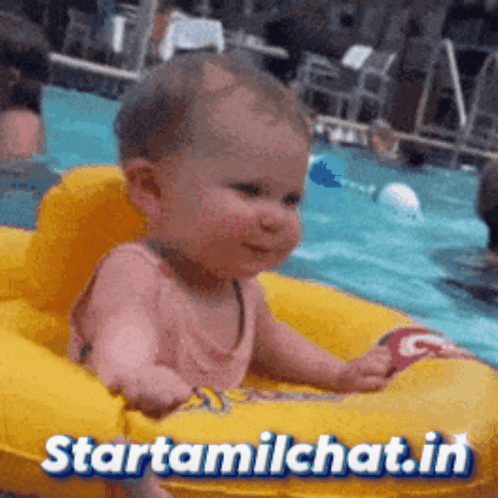 A Baby Is Sitting On An Inflatable Raft In A Pool With The Website Starttamilchat.in Written On The Bottom GIF