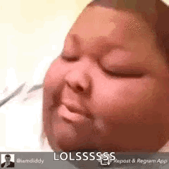 A Baby Is Sleeping With His Eyes Closed And Making A Funny Face With His Mouth Open . GIF