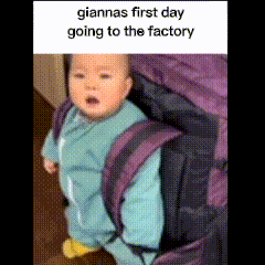 A Baby Is Standing Next To A Purple Backpack That Says " Giannas First Day Going To The Factory " On It GIF