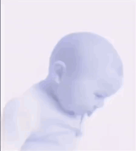 Baby Wearing Purple Shirt Making Sad Face GIF