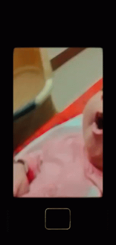 A Baby Is Yawning With A Square In The Corner GIF