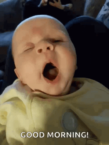 A Baby Is Yawning With The Words Good Morning Written In The Corner GIF