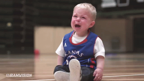 A Baby Wearing A Kansas Jersey Is Crying GIF