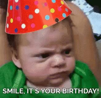 A Baby Wearing A Party Hat With The Words Smile It 'S Your Birthday Written Below It GIF