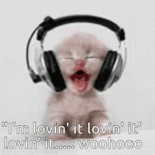 A Baby Wearing Headphones Says I 'M Lovin ' It Lovin ' It Lovin ' It GIF