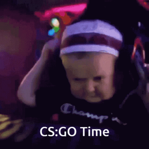 A Baby Wearing Headphones With The Words Cs Go Time Below Him GIF