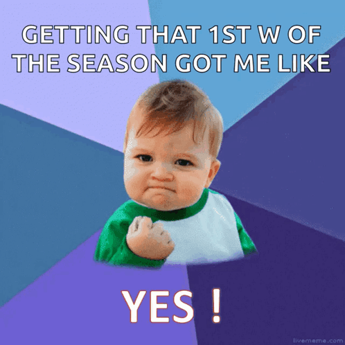 A Baby With A Fist In The Air With The Words Getting That 1St W Of The Season Got Me Like Yes GIF