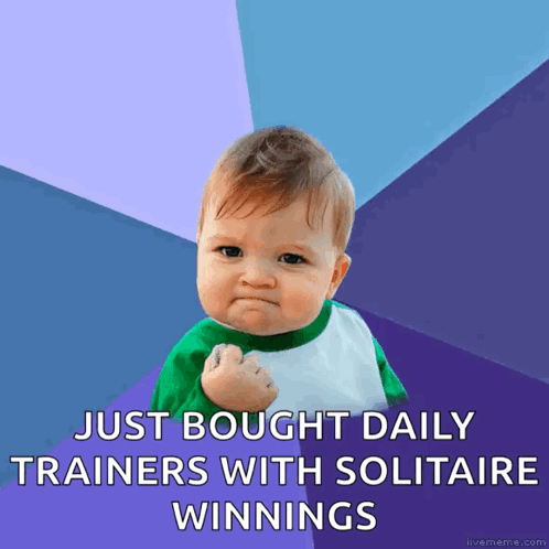 A Baby With A Fist In The Air With The Words Just Bought Daily Trainers With Solitaire Winnings GIF