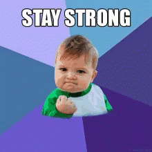 A Baby With A Fist Up And The Words Stay Strong GIF