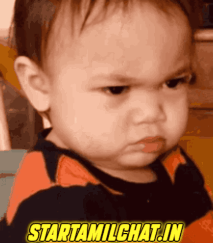 A Baby With An Angry Look On His Face And The Words Starttamilchat.in Above Him GIF