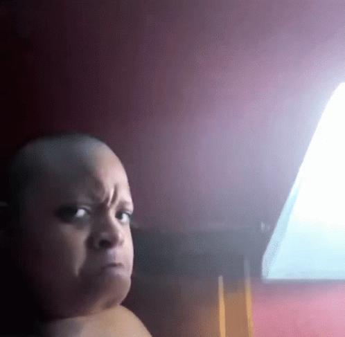 A Baby Without A Shirt Is Making A Funny Face GIF