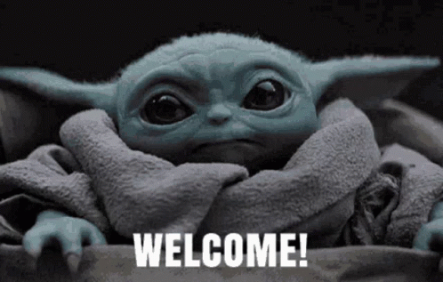 A Baby Yoda From Star Wars Is Wrapped In A Blanket And Says Welcome . GIF