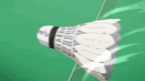 A Badminton Shuttlecock Is Flying Through The Air With Chinese Writing Behind It GIF