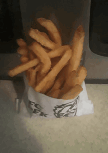 A Bag Of French Fries From A Kfc Restaurant GIF