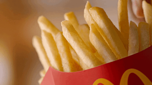 A Bag Of Mcdonald 'S French Fries In A Red And Yellow Box GIF