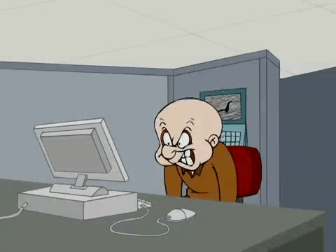 A Bald Cartoon Character Is Sitting At A Desk Looking At A Computer Screen . GIF