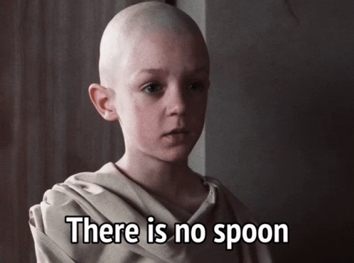 A Bald Child With The Words There Is No Spoon Written Below Him GIF