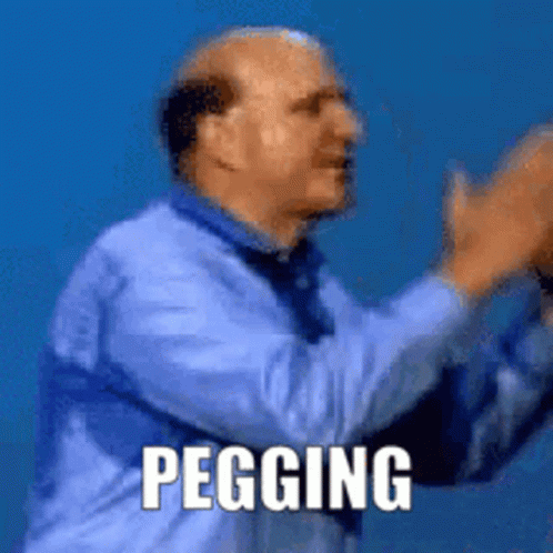 a bald man in a blue shirt and tie is clapping his hands with the word pegging written below him .
