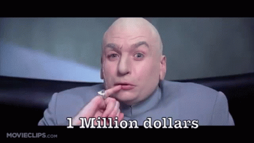 A Bald Man In A Blue Suit Is Holding A Coin In His Hand And Says 1 Million Dollars GIF