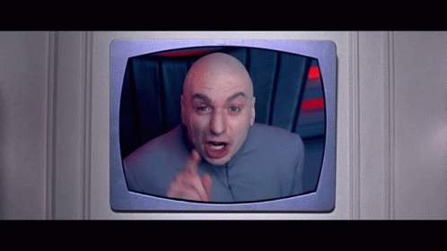 A Bald Man In A Gray Suit Is Giving The Middle Finger GIF