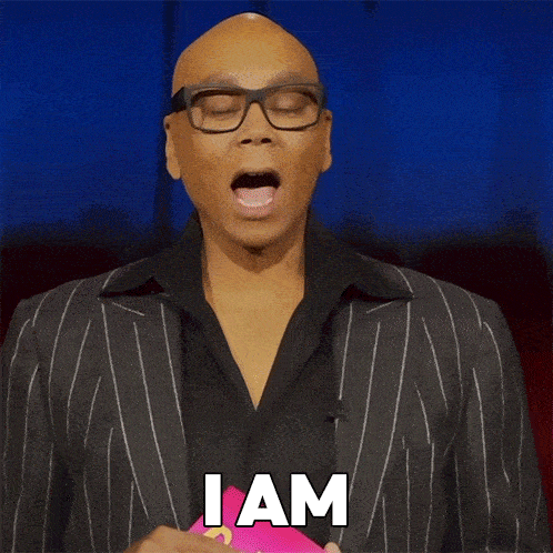 A Bald Man In A Suit And Glasses Says Unbothered GIF
