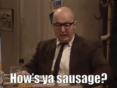 A Bald Man In A Suit And Tie Is Asking How 'S Ya Sausage ? GIF