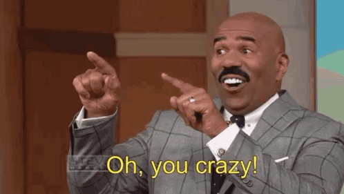 A Bald Man In A Suit And Tie Is Pointing At Something And Saying `` Oh , You Crazy ! '' GIF