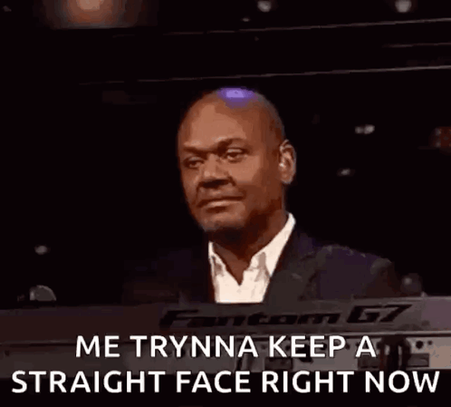 A Bald Man In A Suit And Tie Is Smiling And Says `` Me Trynna Keep A Straight Face Right Now '' . GIF