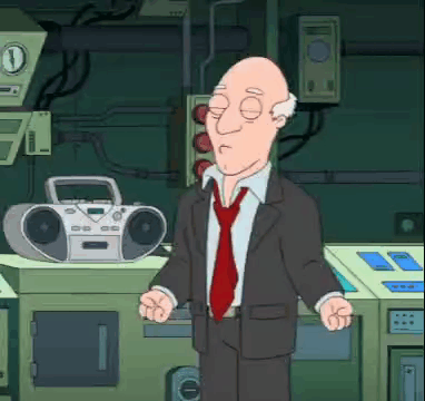 Bald Man In Suit And Tie Standing In Front Of Boombox GIF