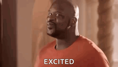 A Bald Man In An Orange Shirt Is Standing In Front Of A Punching Bag And Saying Excited . GIF