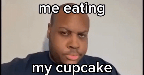 A Bald Man Is Eating A Cupcake And Making A Face . GIF