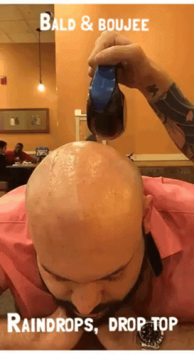 A Bald Man Is Getting A Haircut With The Words Bald & Boujee Raindrops Drop Top At The Bottom GIF