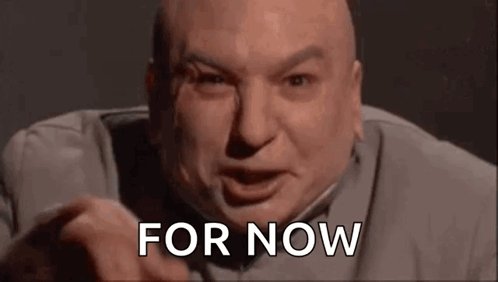 A Bald Man Is Making A Funny Face And Pointing At The Camera While Saying `` For Now '' . GIF