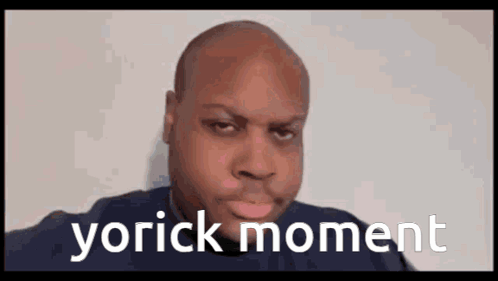 A Bald Man Is Making A Funny Face With The Words Yorick Moment Written On The Bottom . GIF